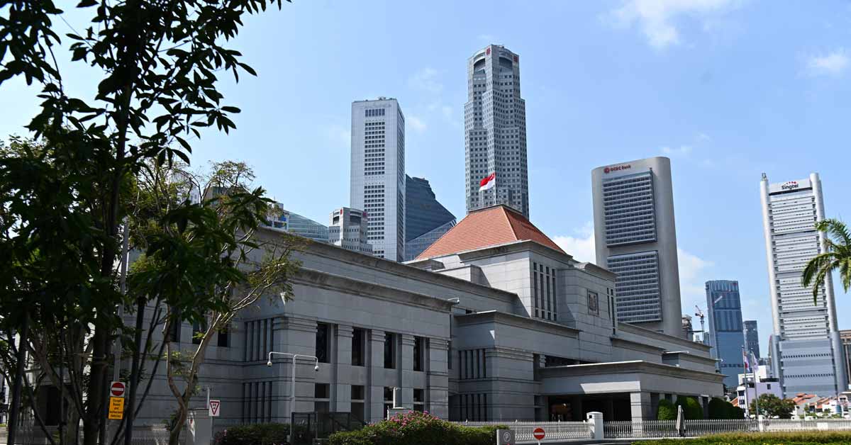 In this file photo, Singapore’s national flag flies on the roof of the Parliament House in Singapore. (AFP Photo)