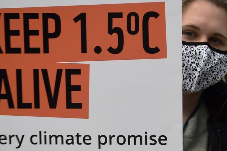 A climate activist protests at COP26