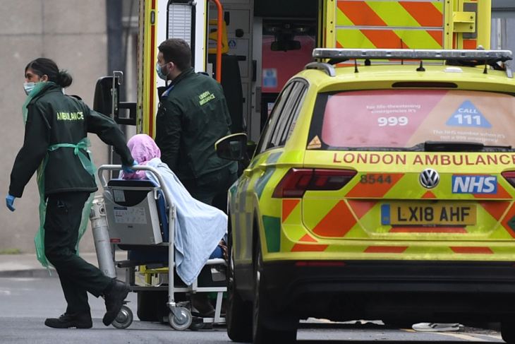 Patient being taken into a hospital in London