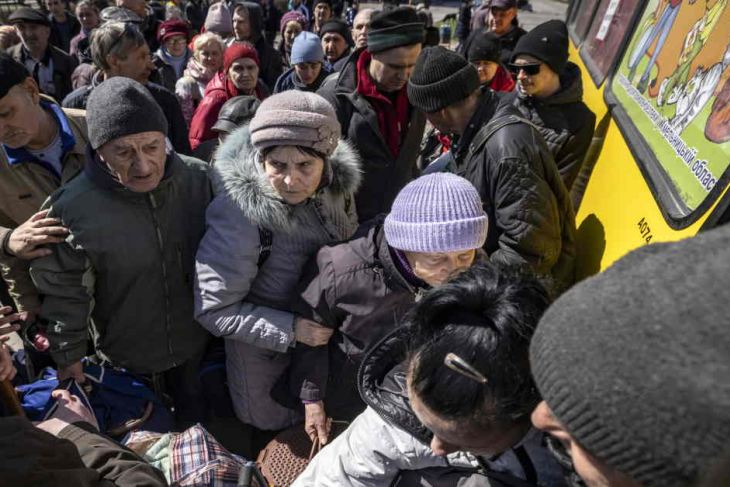 People board a bus in Donbas