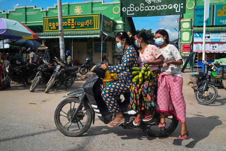 Women riding a motorcycle in Sagaing