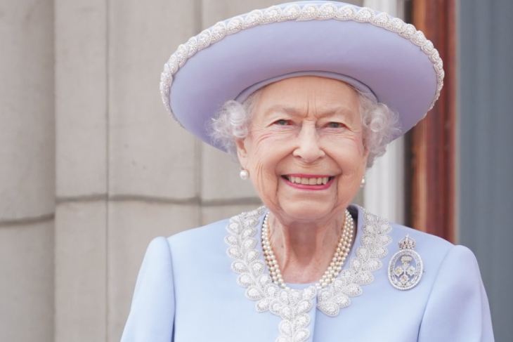 Queen Elizabeth II stands on the balcony