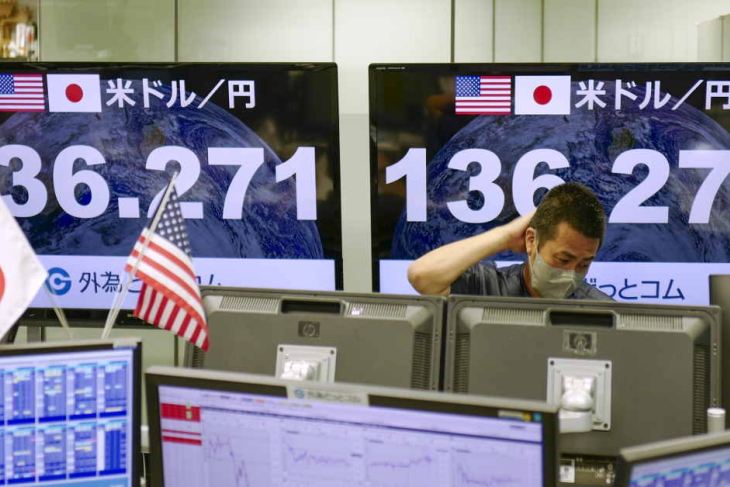 Electronic quotation boards display the yen's rate against the US dollar