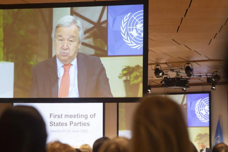 Antonio Guterres (on screen) delivers a video message during The Treaty on the Prohibition of Nuclear Weapons Meeting 