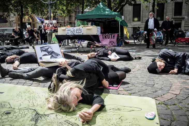 Activists take part in a 'die-in' action